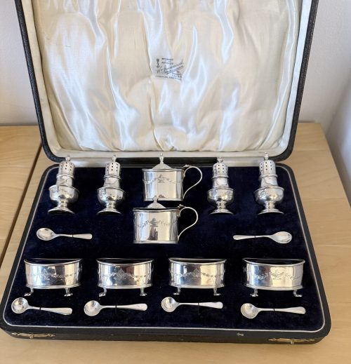 Unusual 16 piece silver cruet set Birmingham 1929