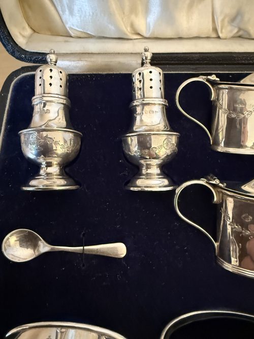 Unusual 16 piece silver cruet set Birmingham 1929
